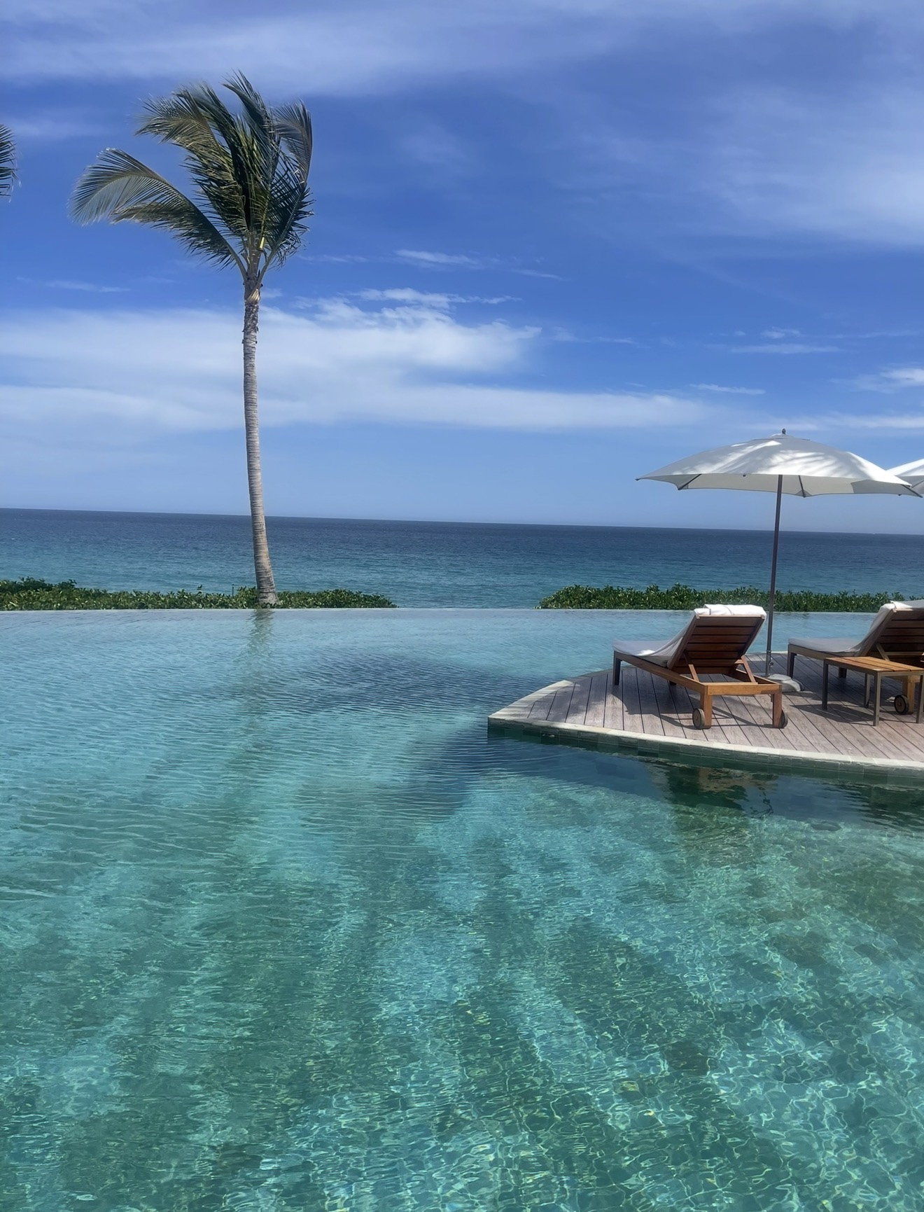 Grand Velas Los Cabos Ambassador Suite bedroom with luxury linens and ocean view