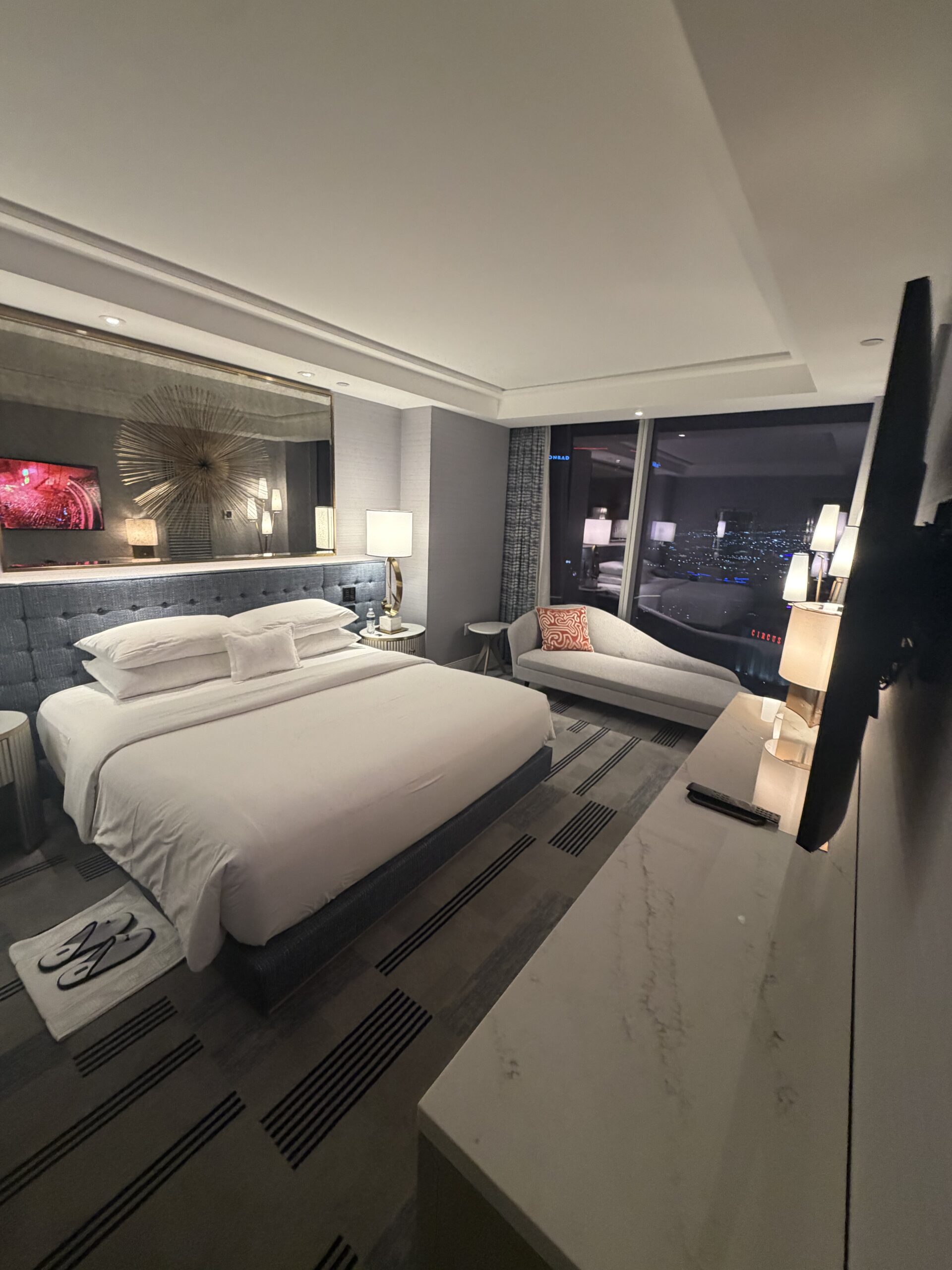 King bed in the Regal Suite at Fontainebleau Las Vegas with floor to ceiling window and city view