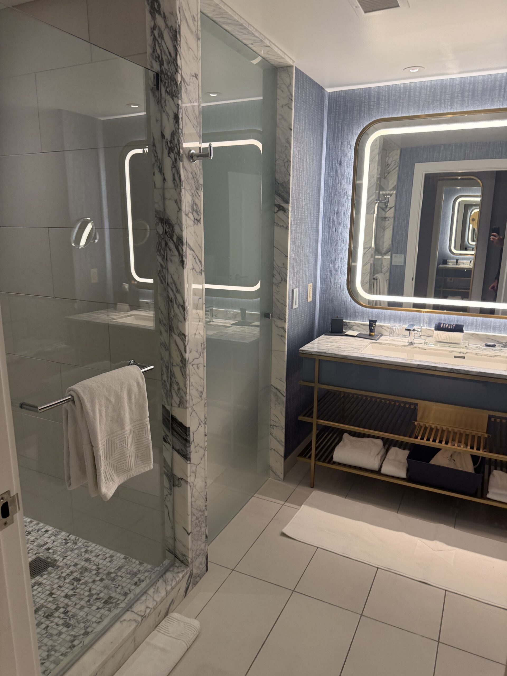 Marble double vanity and glass shower in the Regal Suite bathroom at Fontainebleau Las Vegas
