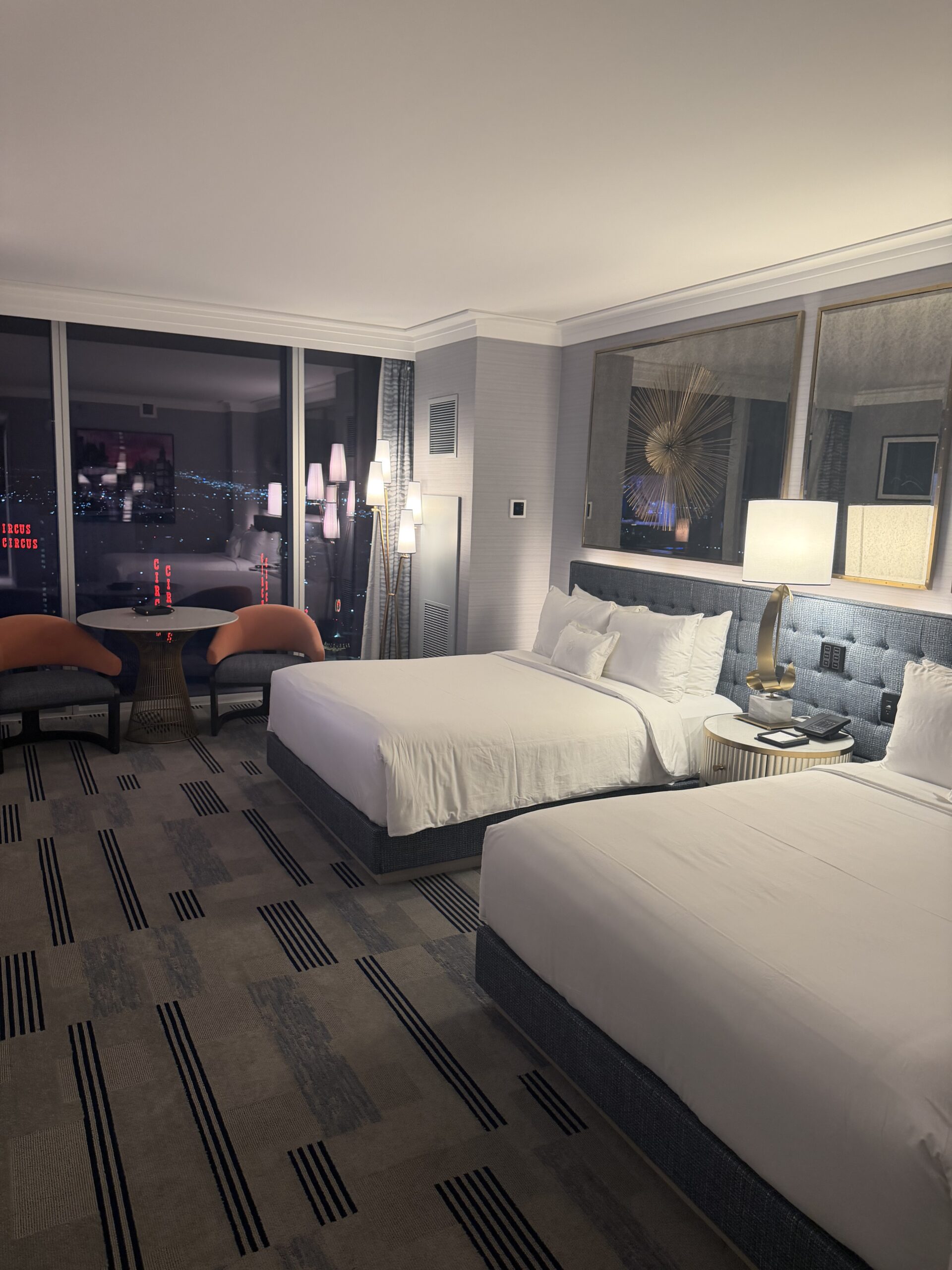 Two queen bedroom at Fontainebleau Las Vegas with nighttime Las Vegas Strip view