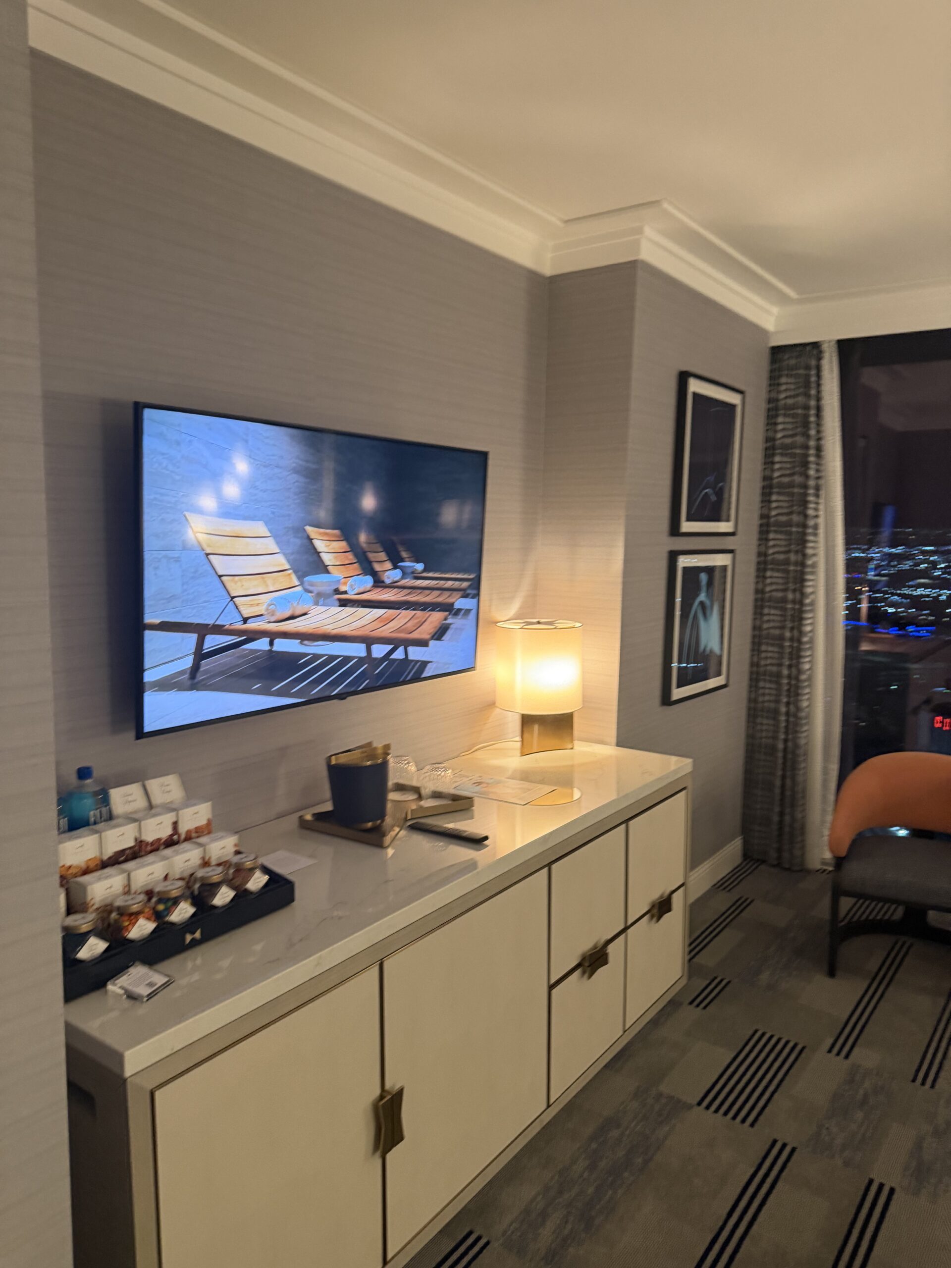Suite entertainment area with TV and stocked minibar at Fontainebleau Las Vegas